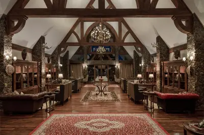 a large room with chairs and a chandelier at Ngorongoro Oldeani Mountain Lodge in Oldeani