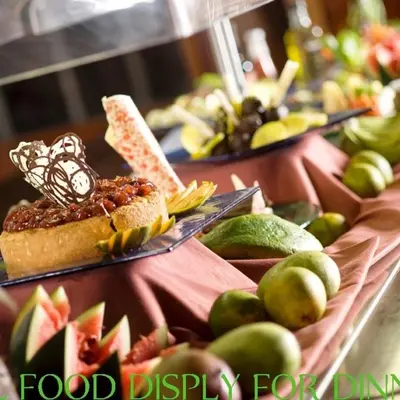 a table with food display with bread and fruit at Lobo Wildlife Lodge in Serengeti