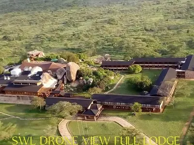 an aerial view of a mansion with a view of a field at Lobo Wildlife Lodge in Serengeti