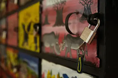 a lock on a door with a picture of elephants at Viva Tanzania in Arusha