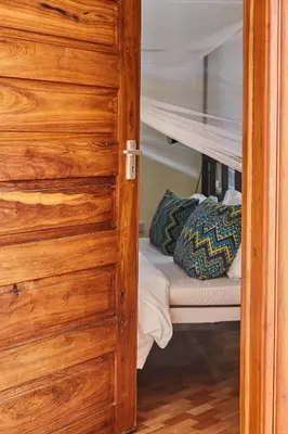ajar door of a bunk bed with a bunk bed at Viva Tanzania in Arusha