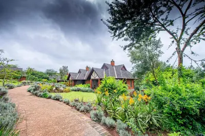 a house with a garden in front of it at The Retreat at Ngorongoro in Karatu