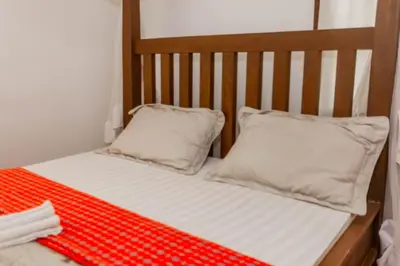 a crib with two pillows on top of it at City Villa in Arusha