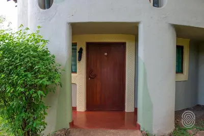 a entrance to a house with a wooden door at Lake Manyara Serena Safari Lodge in Karatu