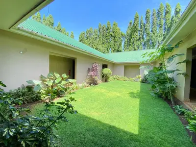 an internal view of a house with a yard at Sangana Lodge in Moshi