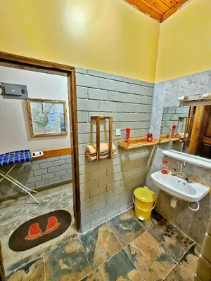 a bathroom with a sink and a toilet at Mazzola Safari House & Backpacking in Arusha