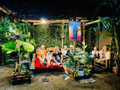 a group of people sitting on a couch at Savannah House in Arusha