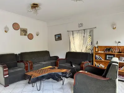 a living room with couches and a table at Wakawaka Hostel Arusha in Arusha