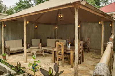 a gazebo with a table and chairs at Mama Wilsen House in Arusha