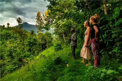 two people standing in a field of grass at Banana Farm Eco Hostel in Arusha
