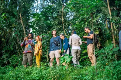 a group of people standing in the forest at Banana Farm Eco Hostel in Arusha