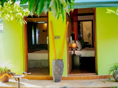 a room with a room with a room with a surfboard at Fun Retreat Resort, Hotel and Ayurveda Spa in Arusha
