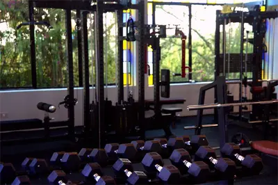 a gym with a bunch of chairs in it at Pink Flamingo Boutique Hotel in Moshi