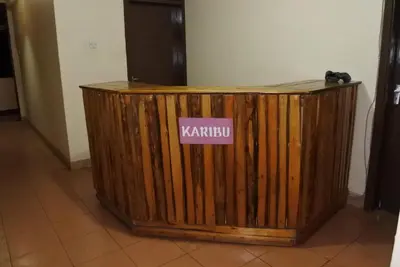 a wooden box with a sign on it at Climbers Home in Moshi