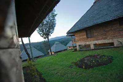 a view of a house with a green yard at Neptune Ngorongoro Luxury Lodge - All Inclusive in Ngorongoro