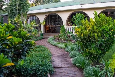 a brick path in front of a house at Kiwavi Home in Moshi