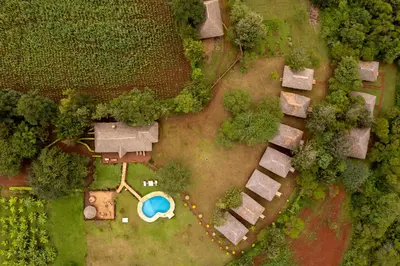 an overhead view of a yard with a swimming pool at Karatu Tented Lodge in Karatu