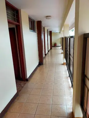 a hallway of a building with a tile floor at Kilimanjaro Star Hotel in Moshi