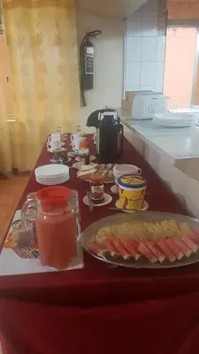 a table with food on it in a kitchen at Kilimanjaro Star Hotel in Moshi