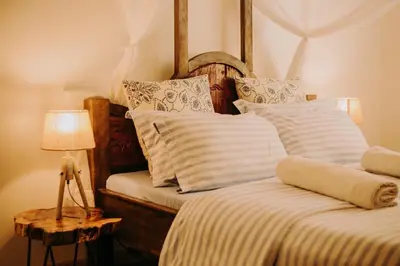 two beds sitting next to each other in a bedroom at Mambo Hideaway in Arusha