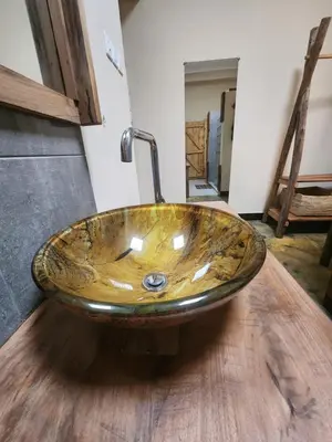 a bathroom with a sink on a wooden floor at Haradali's Home in Arusha