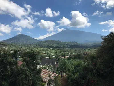 a view of a city with a mountain in the background at Enjivai Hostel in Arusha