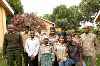 a group of people standing in front of a house at Africa Safari Arusha in Arusha