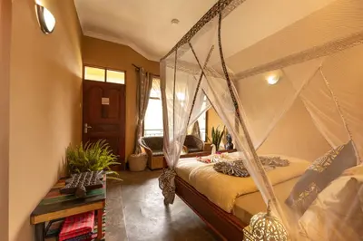 a bedroom with a bed with a canopy at Africa Safari Arusha in Arusha
