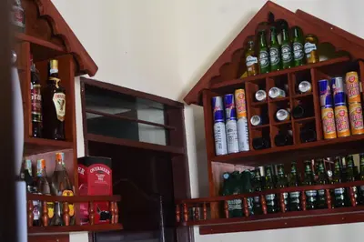 a room with many bottles of alcohol on the wall at Kilimanjaro White House Hotel in Moshi