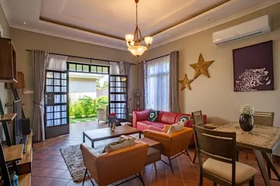 a living room with a couch and a table at Kinga Homes Boutique Hotel in Moshi