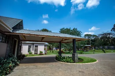 a pavilion in front of a building at Kinga Homes Boutique Hotel in Moshi