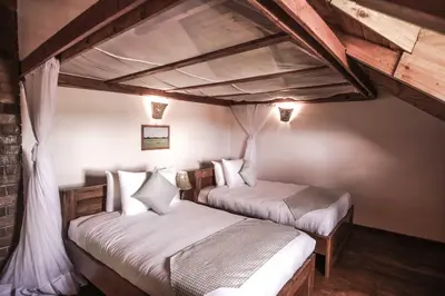 a bedroom with two beds in a room at Ngorongoro Marera Mountain View Lodge in Karatu