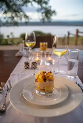 a table with a plate with a dessert on it at Manyara's Secret in Mto wa Mbu