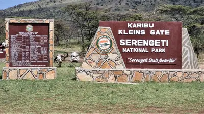 a sign for the karuna khene gate serbiankrit national park at Africa Safari Maasai Boma in Serengeti