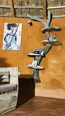 a wall with three shelves on the side of a building at Africa Safari Maasai Boma in Serengeti