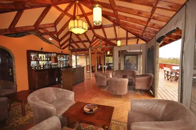 a living room with chairs and a table at Elephant Rock Luxury Camp Tarangire in Kaiti