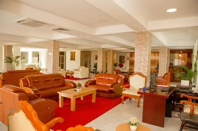 a lobby with couches and chairs at A1 Hotel and Resort in Arusha