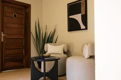 a living room with a couch and a table at Tulia Retreat Hotel and Spa in Arusha