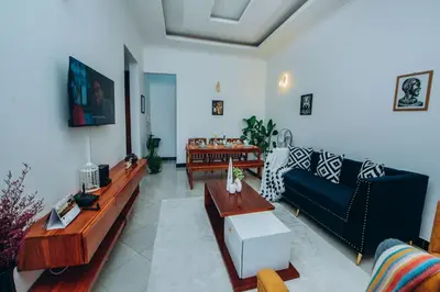 a living room with a couch and a table at Royal Homestay in Arusha