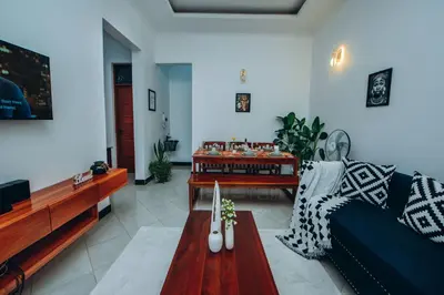 a living room with a couch and a table at Royal Homestay in Arusha