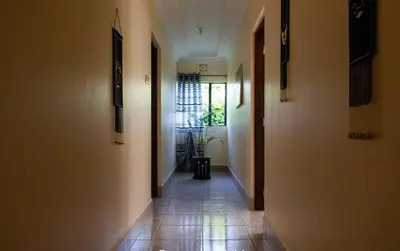 an empty hallway with a hallwayngthngthngthngthngthngthngthngthngthngth at The House of Black and White in Arusha