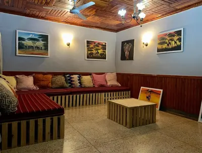 a living room with a couch and a table at Pazuri Hostel in Moshi
