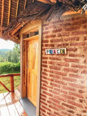 a brick building with a door with a lease sign on it at Foresight Eco Lodge & Safari in Karatu