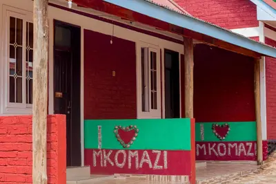a red brick building with a sign that says i heart mwana at Mkomazi Hotels and Camps in Hegoma