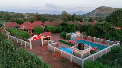 an aerial view of a house with a swimming pool at Randa Cottages Moshi in Kirua