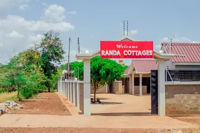 a sign for a rana center in front of a building at Randa Cottages Moshi in Kirua