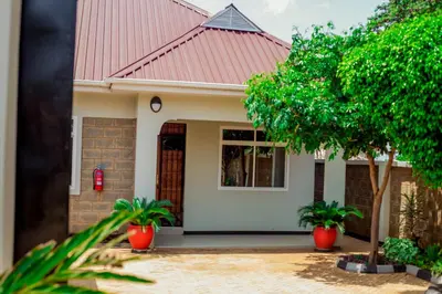 a house with a red roof at Randa Family House - Moshi in Himo