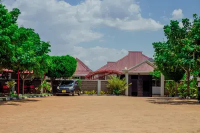 a car parked in front of a house at Randa Family House - Moshi in Himo