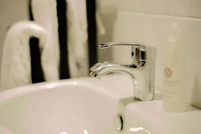 a sink with a faucet in a bathroom at Heart of Africa Lodge in Arusha