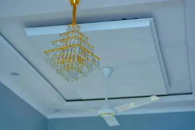 a christmas tree ornament hanging from a ceiling at Johnsons StopPoint in Zame